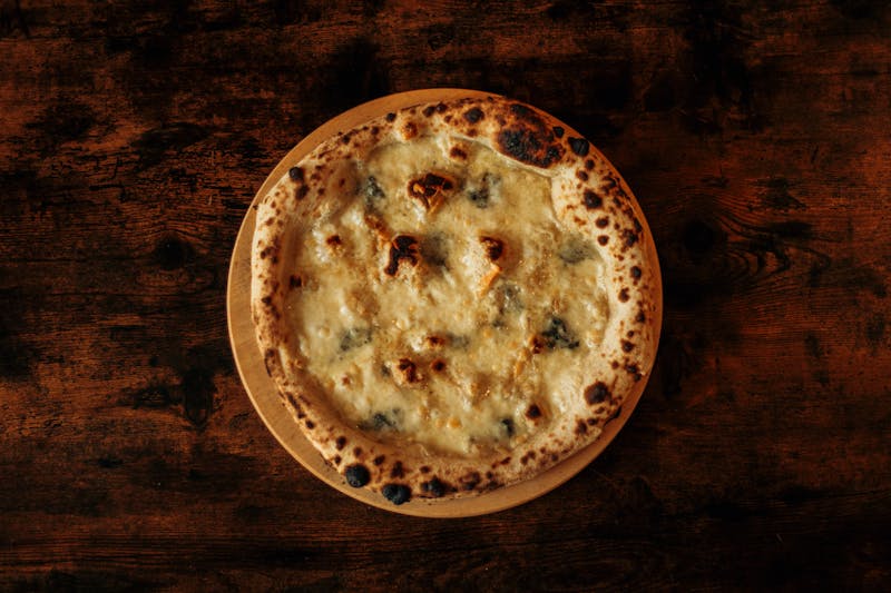 White truffle pizza with burrata and arugula