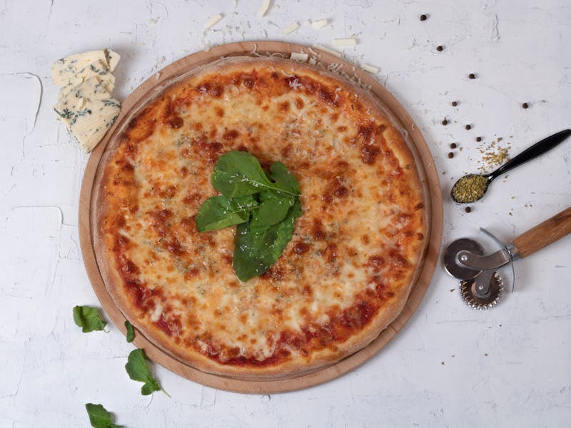 Prosciutto and arugula pizza with fresh mozzarella